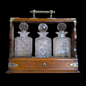 Victorian Silver Plated Oak Tantalus with Three Cut Glass Decanters