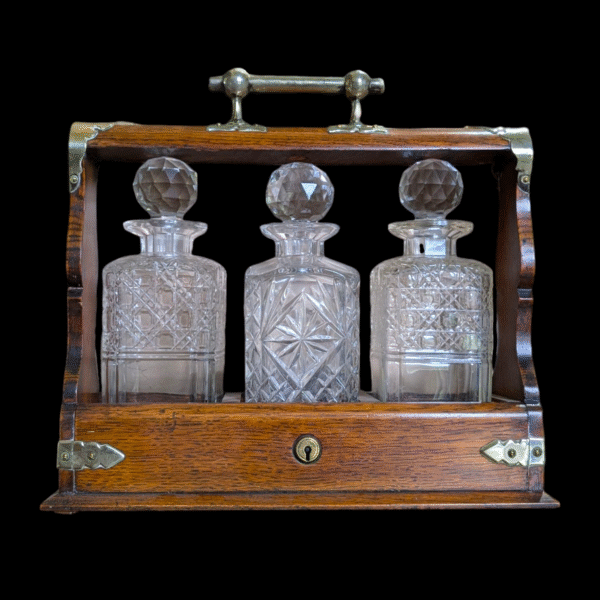 Victorian Silver Plated Oak Tantalus with Three Cut Glass Decanters