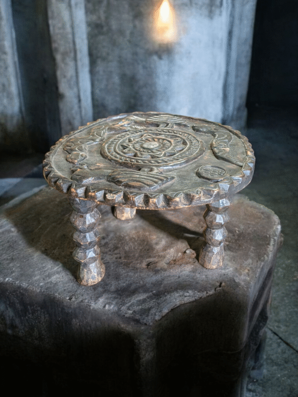 Hand-Carved Tribal Stool with Symbolic Top Design - Image 3