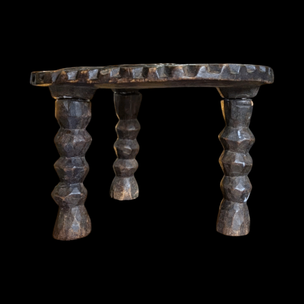Hand-Carved Tribal Stool with Symbolic Top Design - Image 2