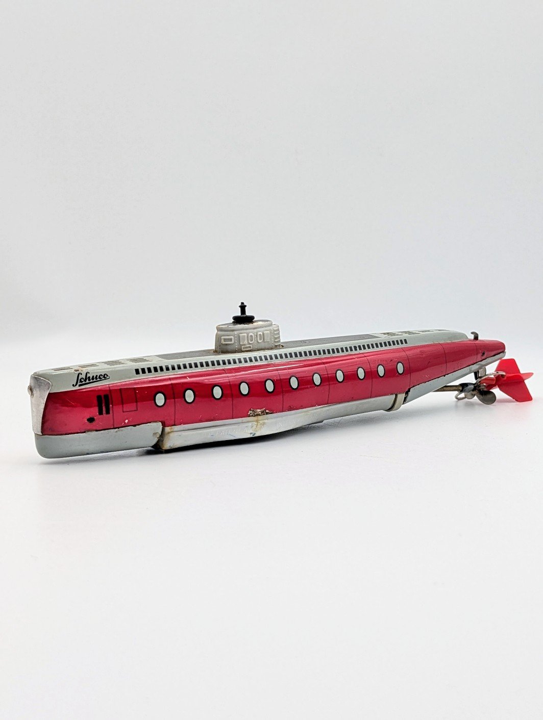Vintage German Schuco Tinplate Clockwork Submarine – Red & Silver